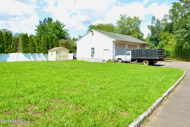 exterior space with mail boxes and a shed