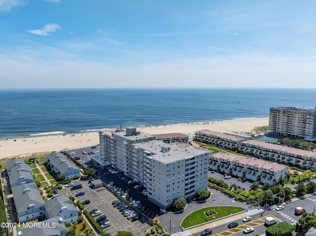 bird's eye view with a beach view and a water view