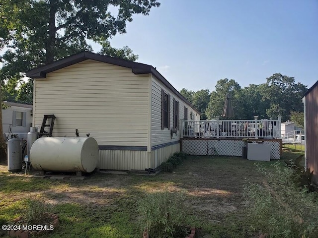 view of side of property with a deck