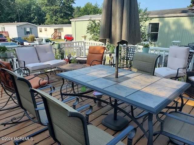 wooden terrace featuring an outdoor living space