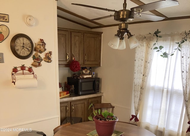 dining space featuring lofted ceiling, ceiling fan, and a wealth of natural light