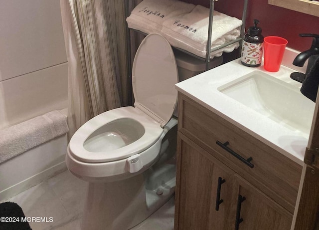 bathroom with shower / bathtub combination with curtain, toilet, and vanity