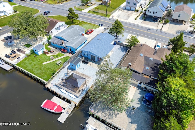 aerial view with a water view and a residential view