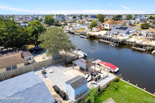 birds eye view of property with a residential view and a water view