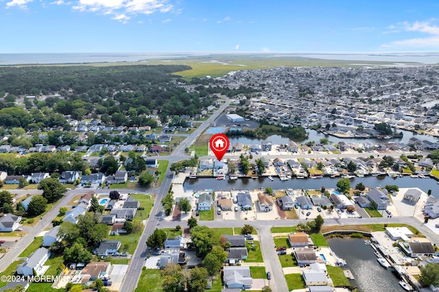 aerial view with a residential view and a water view