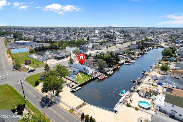 bird's eye view featuring a water view and a residential view