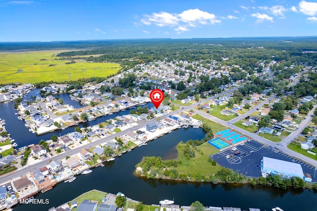 aerial view with a water view and a residential view