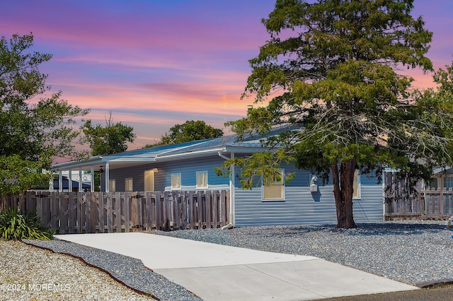 view of front of property featuring fence