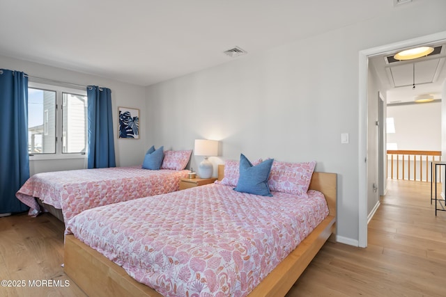 149 Valencia Dr, Brick, NJ 08723 - bedroom featuring attic access and light wood-style floors