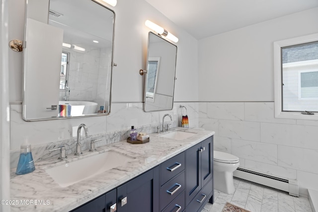 149 Valencia Dr, Brick, NJ 08723 - bathroom featuring a baseboard heating unit, double vanity, healthy amount of natural light, marble look tile flooring, and tile walls