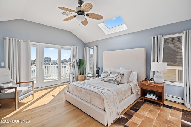149 Valencia Dr, Brick, NJ 08723 - bedroom featuring lofted ceiling, a skylight, access to outside, baseboard heating, and a ceiling fan