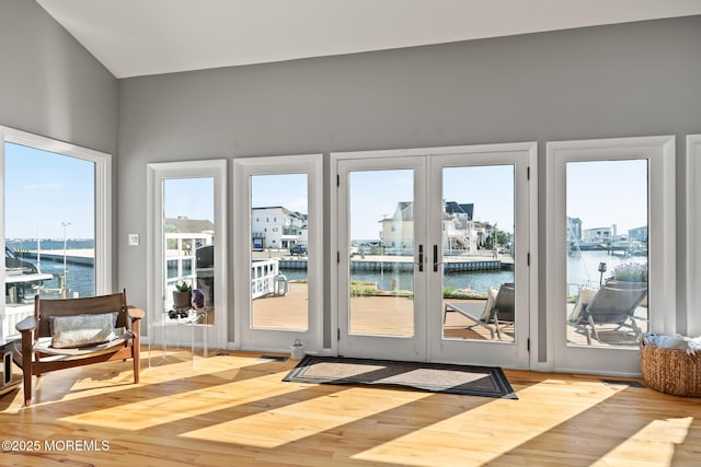 149 Valencia Dr, Brick, NJ 08723 - doorway to outside featuring a water view, wood finished floors, and french doors
