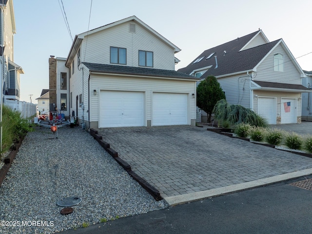 149 Valencia Dr, Brick, NJ 08723 - traditional-style home featuring a garage and decorative driveway