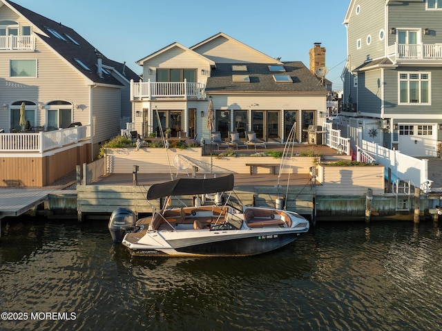 149 Valencia Dr, Brick, NJ 08723 - dock with a balcony, a water view, and a patio area