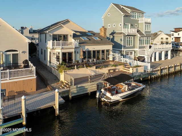 149 Valencia Dr, Brick, NJ 08723 - back of property with a water view, a balcony, and a residential view