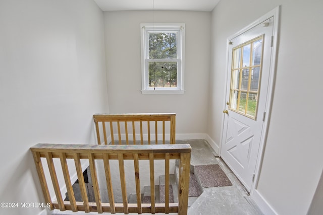 doorway featuring baseboards