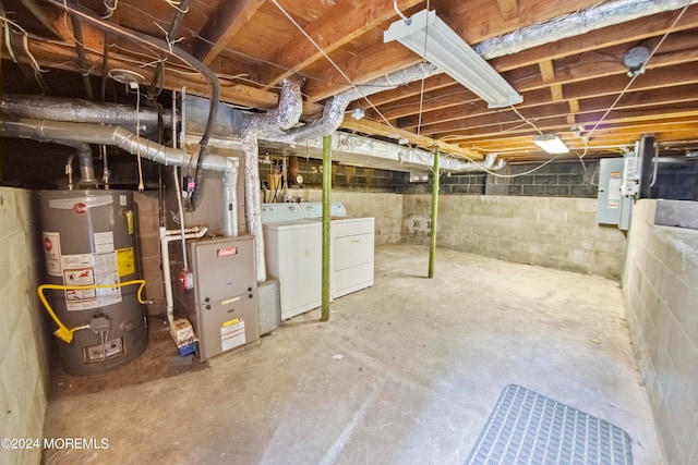 basement featuring gas water heater and washing machine and clothes dryer