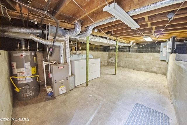 unfinished basement featuring gas water heater and washer and dryer