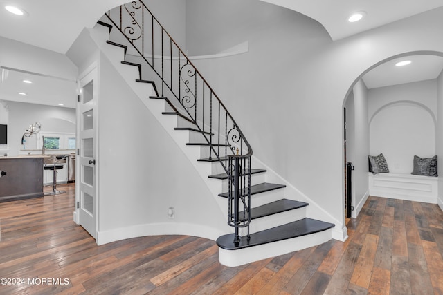 stairs featuring hardwood / wood-style flooring