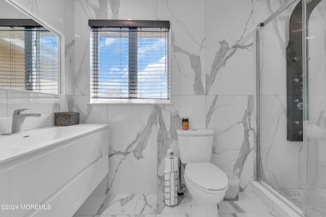 bathroom with tile walls, tile patterned flooring, toilet, and vanity