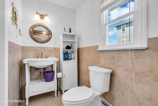 bathroom featuring tile walls, toilet, and tile patterned floors