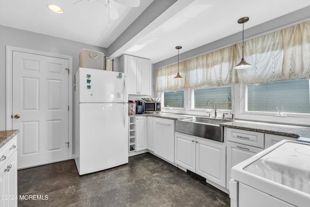 kitchen with pendant lighting, white cabinets, white appliances, and ceiling fan