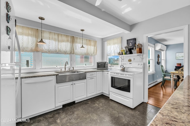 kitchen featuring white cabinets, white appliances, pendant lighting, sink, and a wall mounted air conditioner