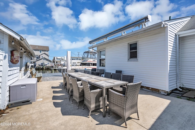 view of patio featuring a water view