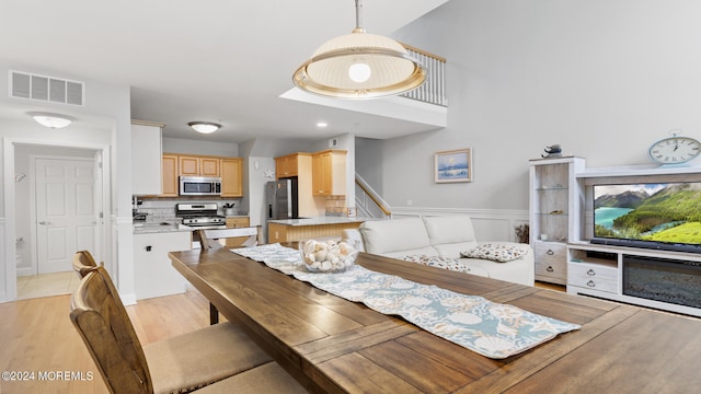 dining room with light wood-type flooring