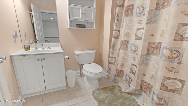 bathroom with vanity, toilet, walk in shower, and tile patterned floors