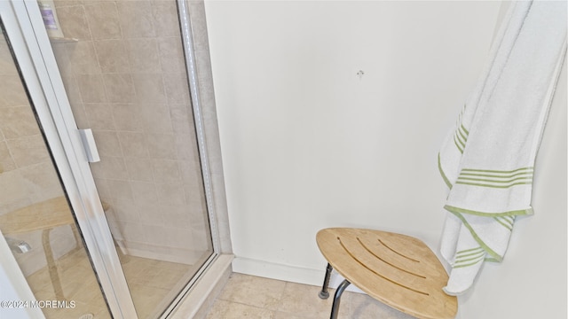 bathroom with tile patterned floors and walk in shower