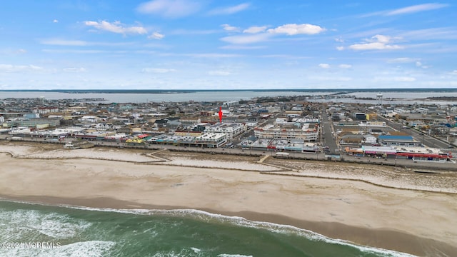 bird's eye view with a beach view and a water view