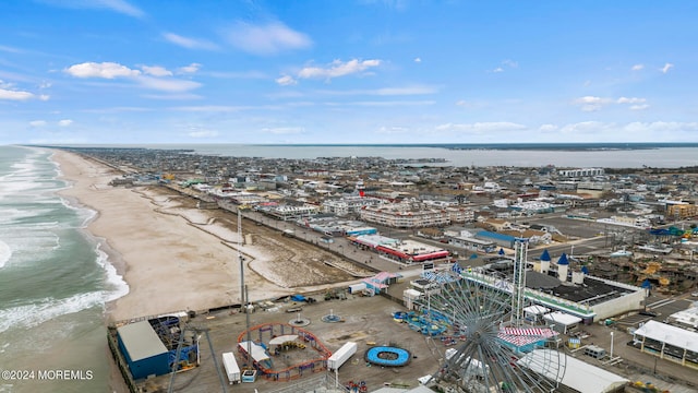 aerial view featuring a water view and a beach view