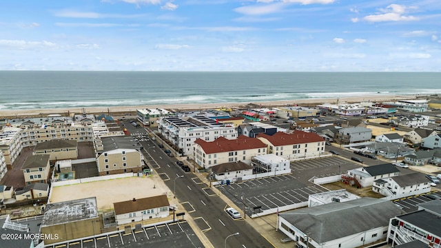 bird's eye view with a view of the beach and a water view