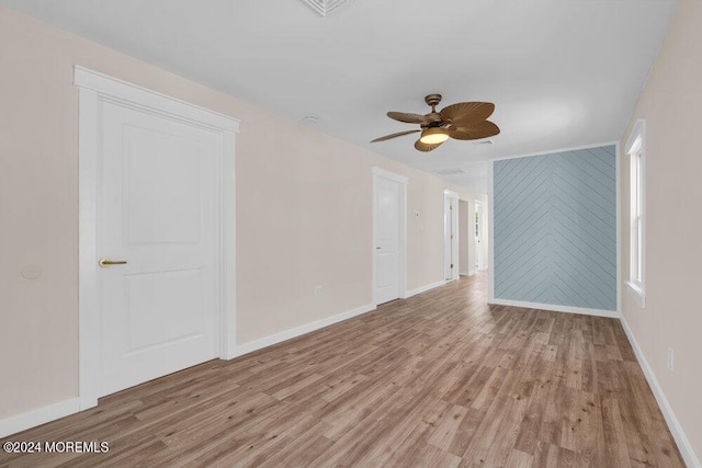 unfurnished room featuring light hardwood / wood-style flooring and ceiling fan