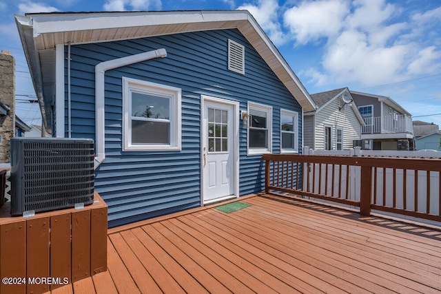 wooden deck with central AC unit