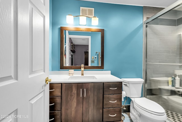 bathroom with vanity, toilet, and an enclosed shower