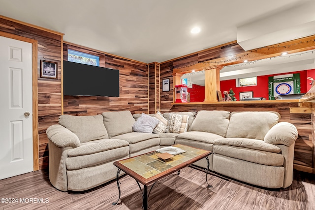 living room featuring wood walls and wood-type flooring