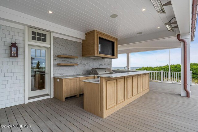 wooden deck with area for grilling and grilling area