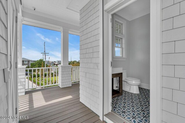 bathroom featuring toilet and plenty of natural light