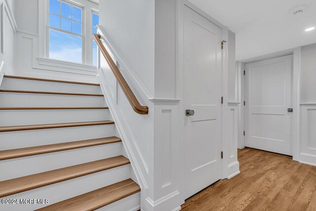 staircase featuring wood-type flooring