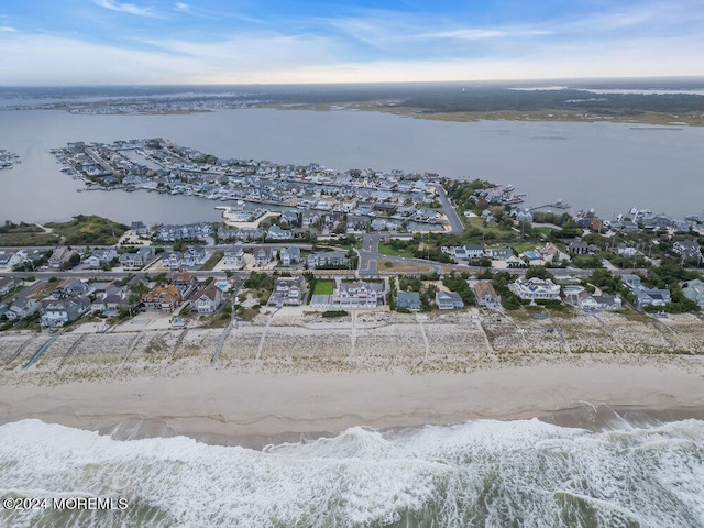 bird's eye view featuring a beach view and a water view