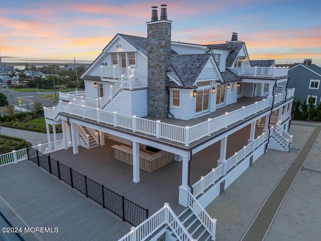 view of front of house with a balcony