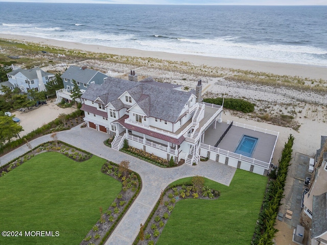 drone / aerial view with a view of the beach and a water view