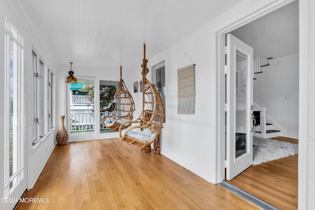 interior space featuring light wood-type flooring and french doors