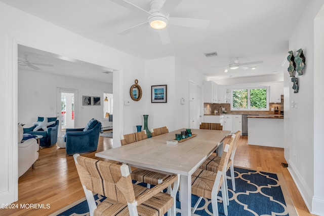 dining area featuring ceiling fan and light hardwood / wood-style floors