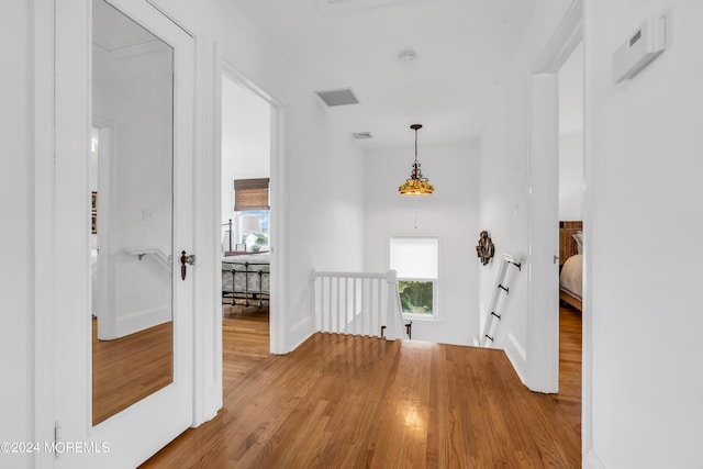 corridor featuring light hardwood / wood-style floors