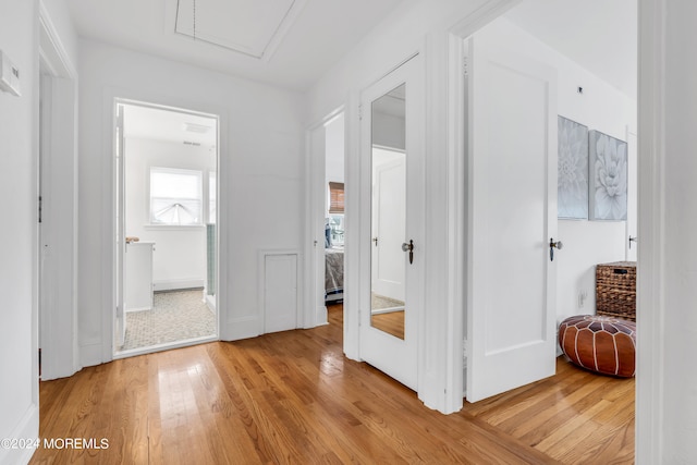 hallway with light wood-type flooring