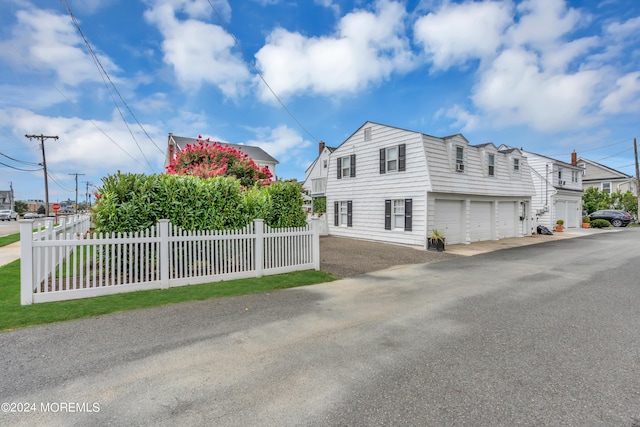 view of side of home with a garage