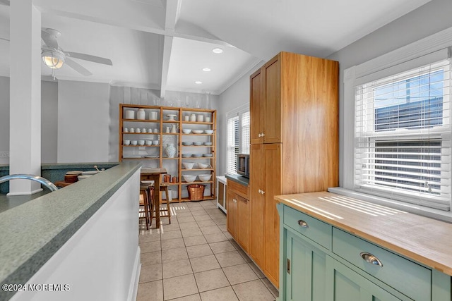 kitchen with beam ceiling, light tile patterned flooring, recessed lighting, ceiling fan, and green cabinets